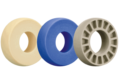 Three industrial rollers in beige, blue, and gray for automation systems.